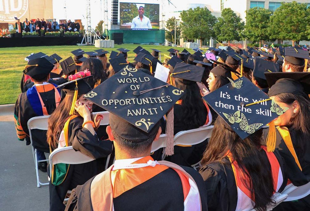 Graduating students decorated caps.