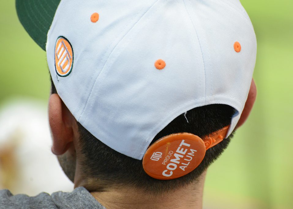 Person wearing UTD-themed Texas Rangers baseball cap.
