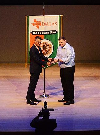 Roger Davis-Jahnel acceting his ring at the UT Dallas Ring Ceremony.