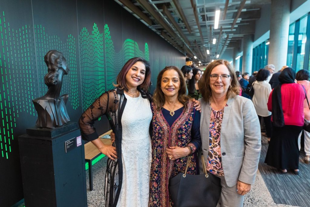 Dr. Shakila Ahmed (center), daughter Araj Ahmed (left) and Provost Inga Musselman (right) posing for a picture.