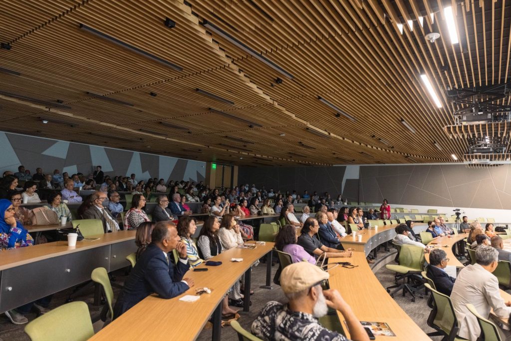 Photo of audience in the newly named Basheer and Shakila Ahmed Auditorium. 