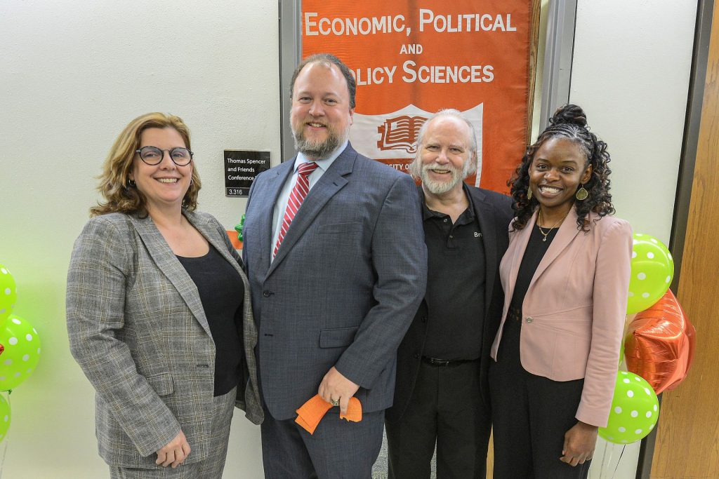 Dr. Jennifer S. Holmes, Thomas Spencer, Jay Scott, and Ravin Cline, posing for a photo.
