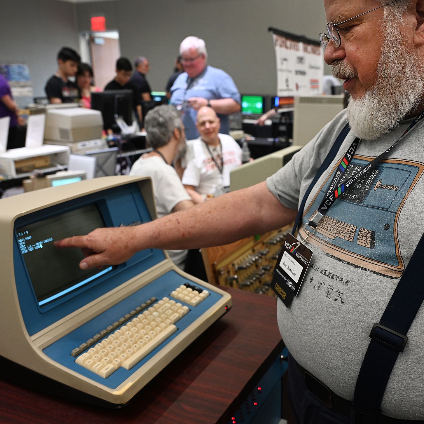 Former computer engineer Ken Romaine looks over a Centurion Computer that he helped design and build in the 1970s.