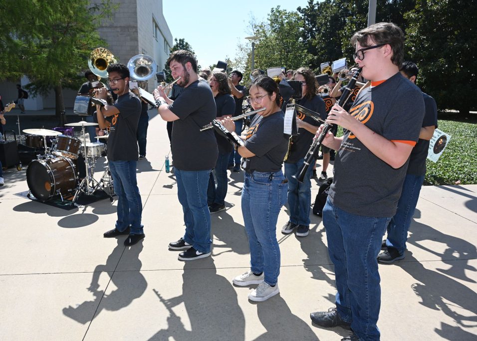 Members of the UT Dallas Pep Band playing their instruments during the Bass School dedication and celebration.
