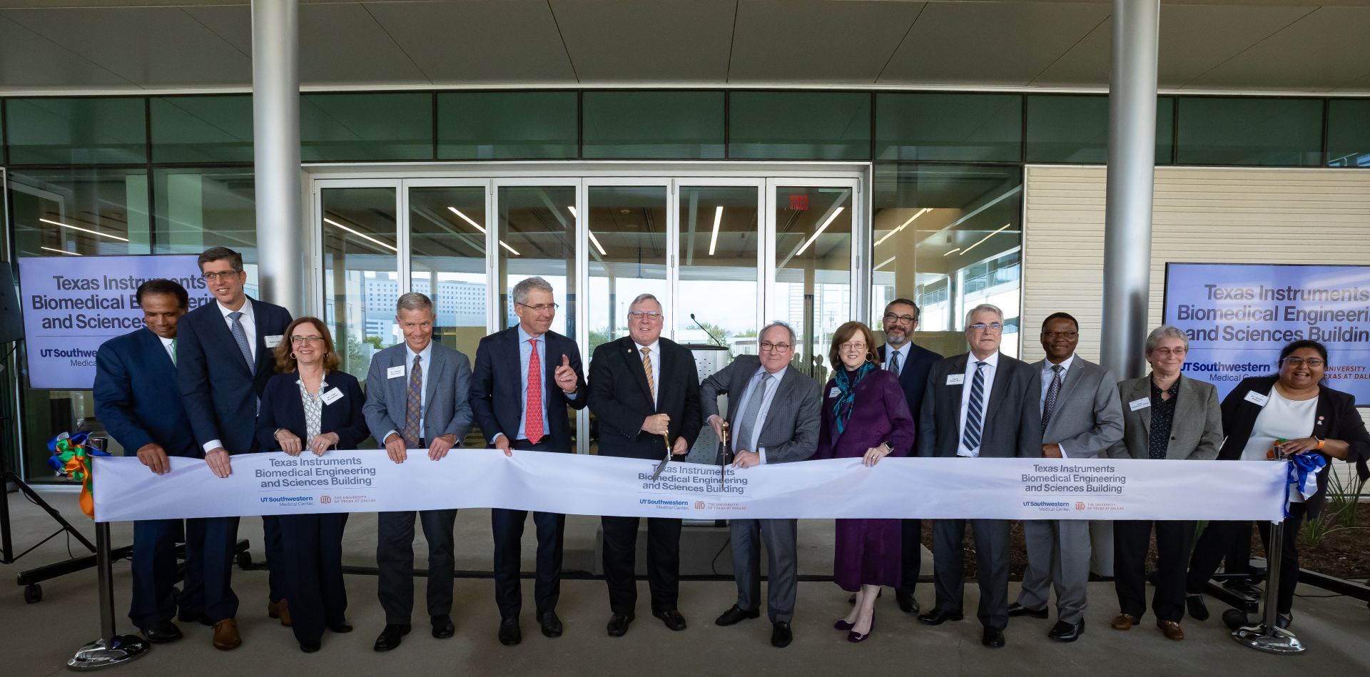 Representatives of UT Dallas and UT Southwestern cut the ribbon opening the Texas Instruments Biomedical Engineering and Sciences Building.