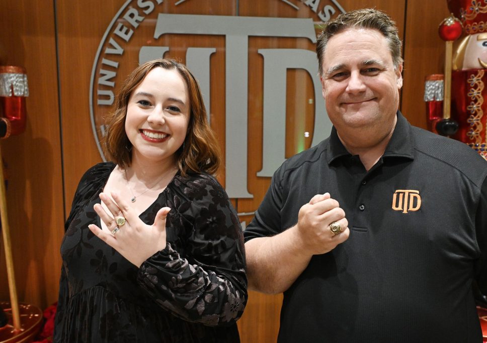 Danielle Royer and Steve Royer show off their UTD rings.
