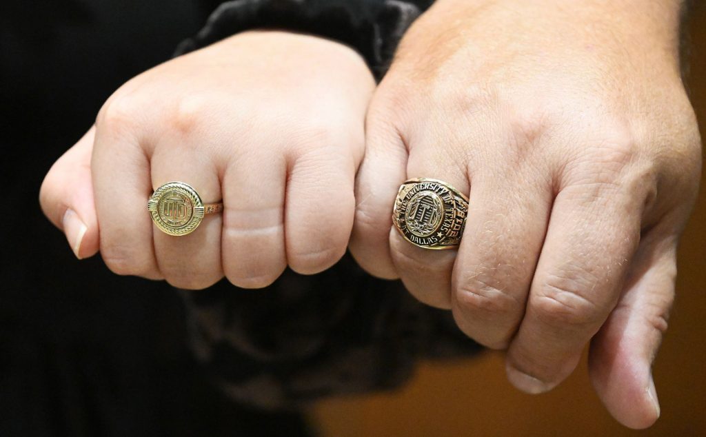 Hands with UTD rings.